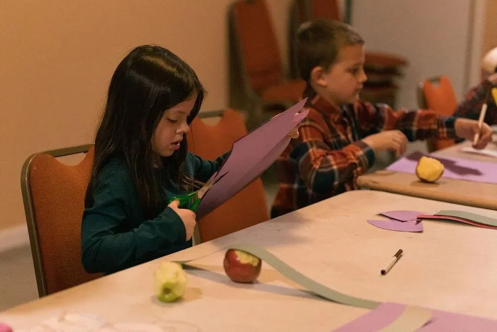 Child Cutting Paper At Life Community Church Of The Nazarene Church In Colorado Springs, CO